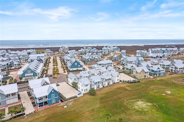 drone / aerial view with a water view and a residential view