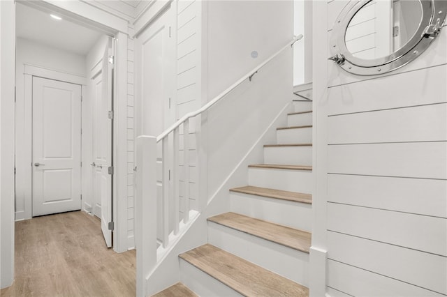 staircase featuring wood finished floors