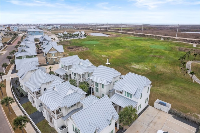 aerial view featuring view of golf course and a residential view