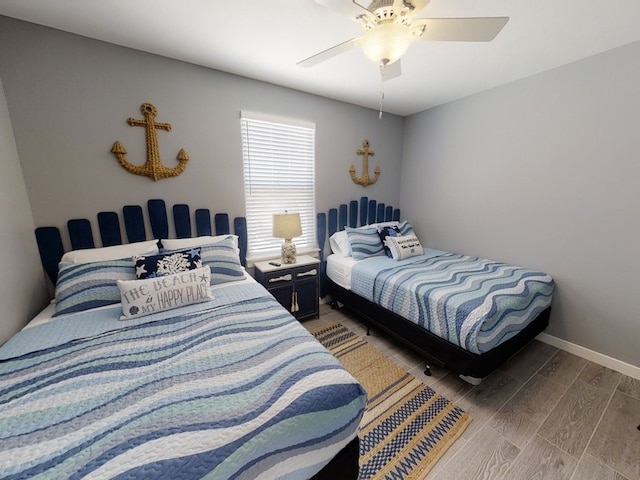 bedroom featuring hardwood / wood-style floors and ceiling fan