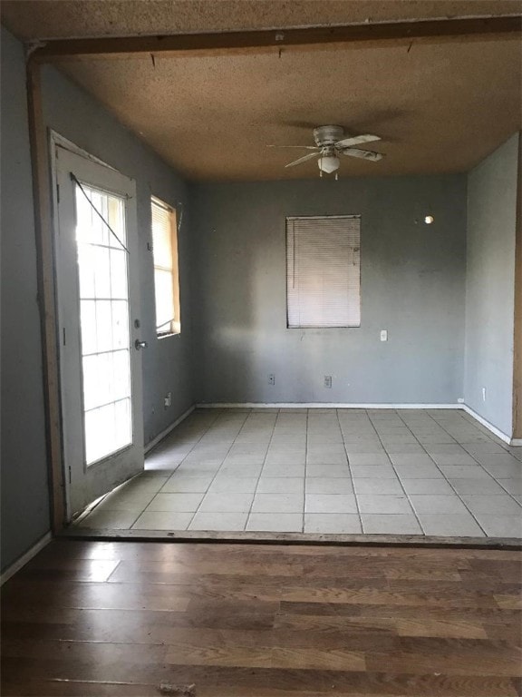 empty room featuring hardwood / wood-style floors and ceiling fan