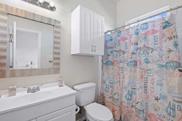 141 Barnacle Dr, Rockport, TX 78382 - bathroom with toilet, vanity, and a shower with curtain