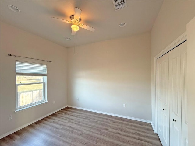 141 Barnacle Dr, Rockport, TX 78382 - unfurnished bedroom with a ceiling fan, baseboards, visible vents, light wood finished floors, and a closet
