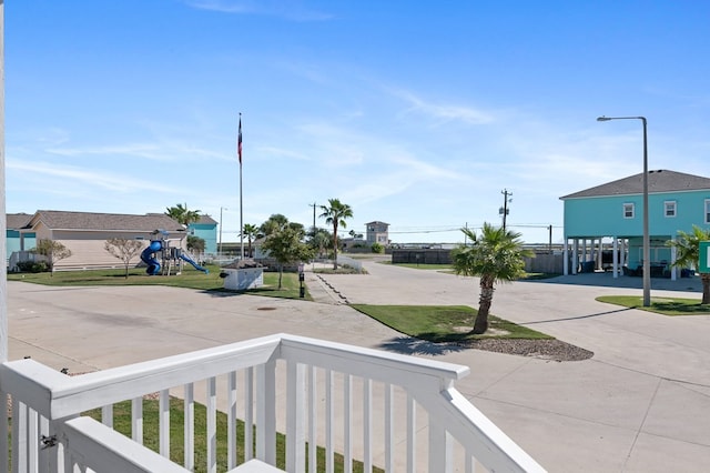 141 Barnacle Dr, Rockport, TX 78382 - exterior space featuring playground community and curved driveway