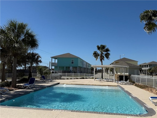 141 Barnacle Dr, Rockport, TX 78382 - community pool featuring a pergola, a patio, and fence