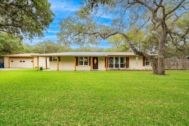 single story home with a garage and a front yard