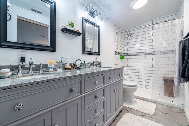 bathroom featuring tile patterned flooring, a shower with shower curtain, vanity, toilet, and vaulted ceiling