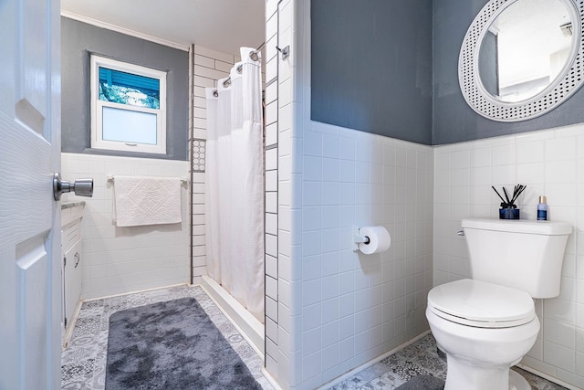 bathroom featuring tile walls, toilet, and a shower with curtain