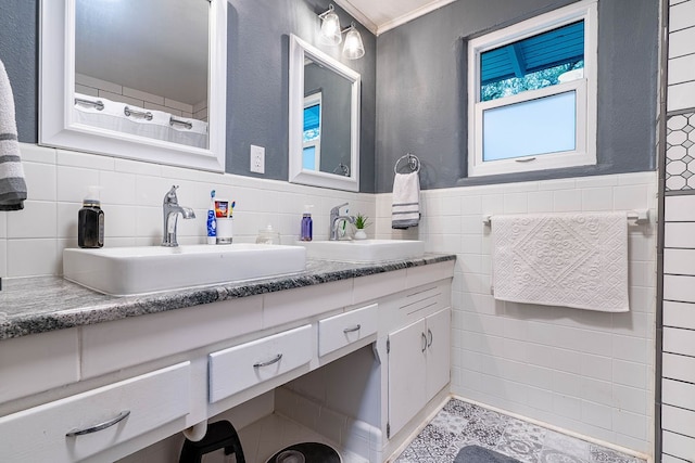 bathroom with vanity, tile walls, and ornamental molding