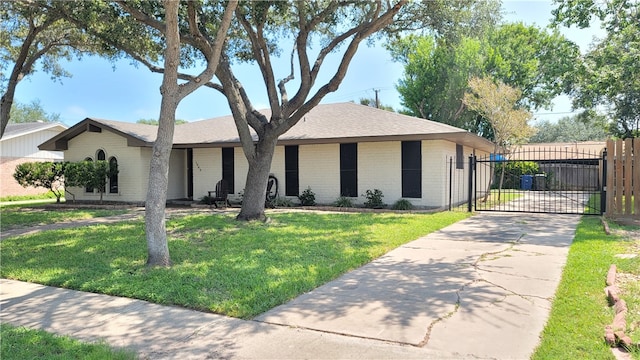 single story home featuring a front yard