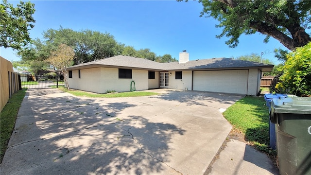 ranch-style house featuring a garage