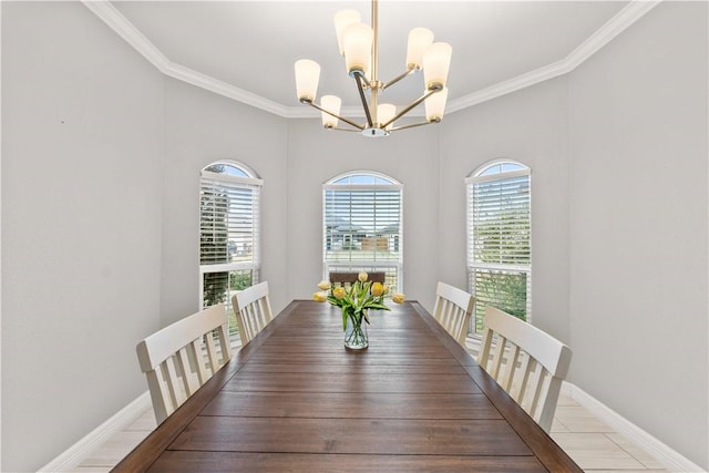 dining area featuring a chandelier and ornamental molding