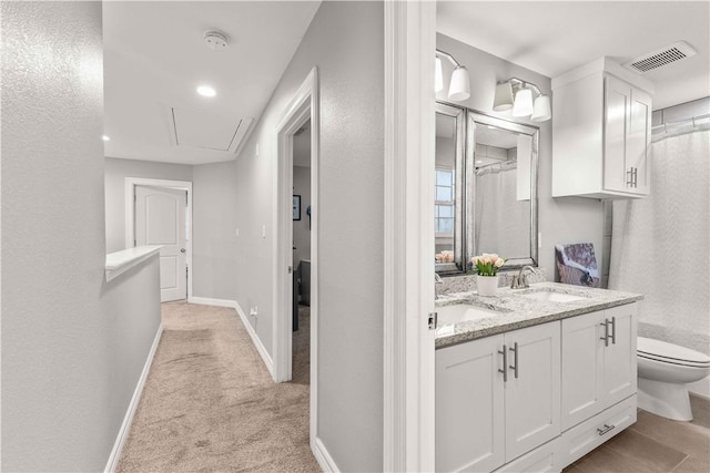 bathroom with vanity and toilet