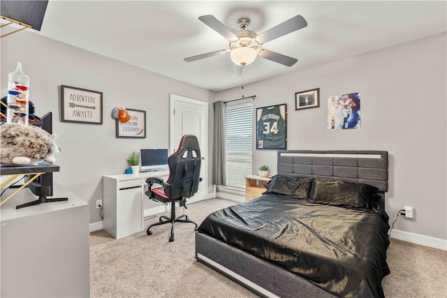 bedroom with ceiling fan and light carpet