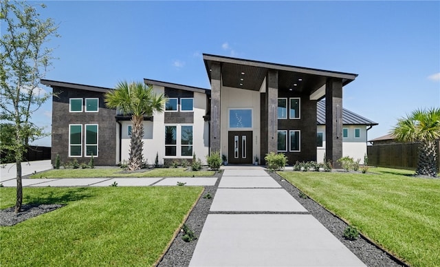 contemporary home featuring a front yard