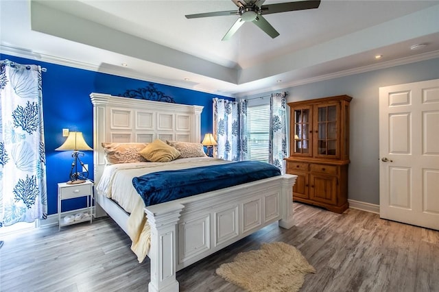 322 Williamson Pl, Corpus Christi, TX 78411 - bedroom with light wood-style floors, a raised ceiling, ceiling fan, recessed lighting, and crown molding