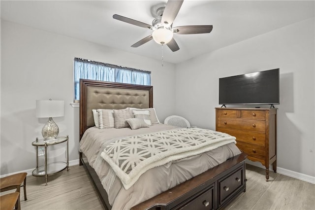 bedroom with light hardwood / wood-style flooring and ceiling fan