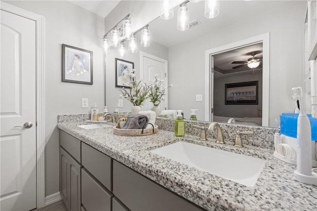 bathroom featuring vanity and ceiling fan