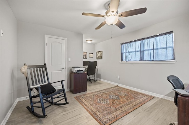 office area featuring ceiling fan and light wood-type flooring