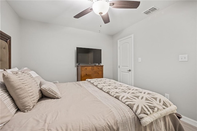 bedroom featuring hardwood / wood-style floors and ceiling fan