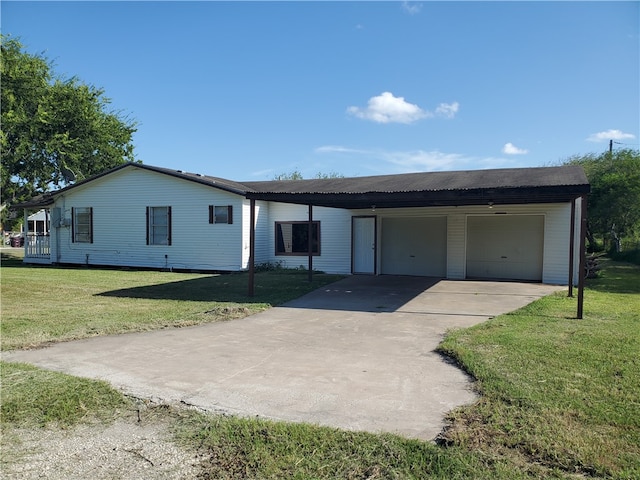 single story home with a garage, a carport, and a front yard