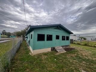 view of home's exterior with a lawn