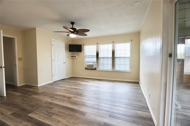 interior space featuring ceiling fan, dark hardwood / wood-style flooring, and cooling unit