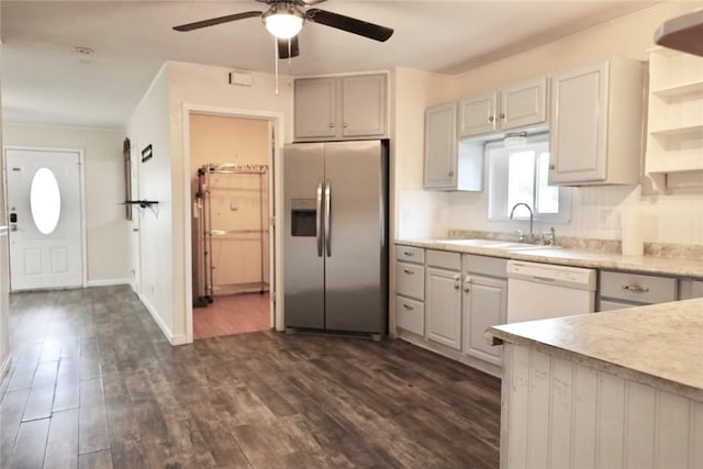 kitchen with ceiling fan, dishwasher, sink, dark hardwood / wood-style floors, and stainless steel fridge