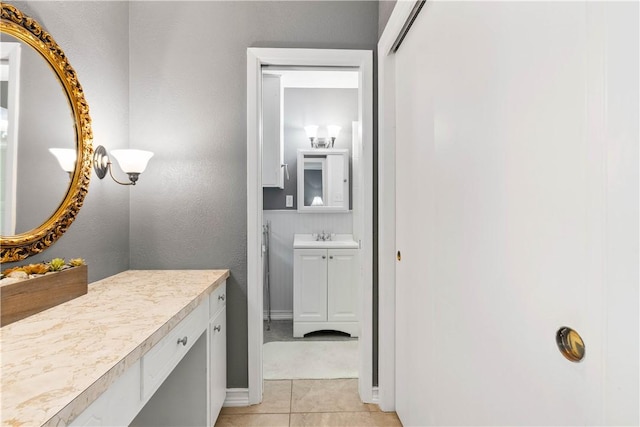 3818 Kingston Dr, Corpus Christi, TX 78415 - bathroom with vanity and tile patterned flooring
