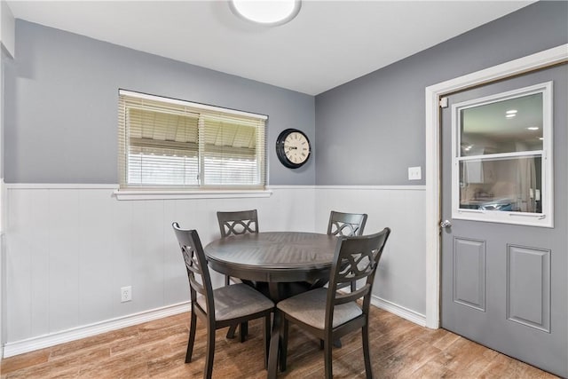 3818 Kingston Dr, Corpus Christi, TX 78415 - dining room featuring wood finished floors and wainscoting