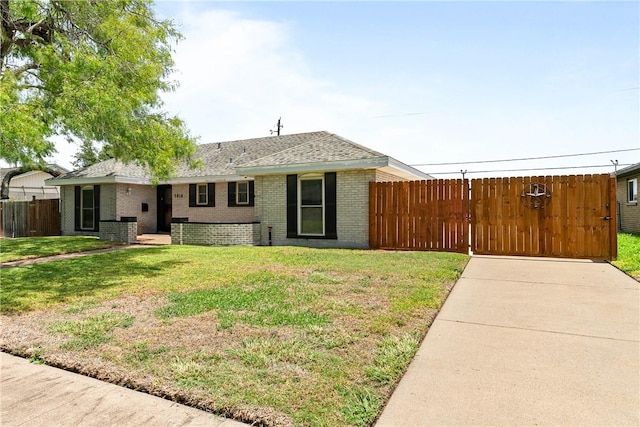 3818 Kingston Dr, Corpus Christi, TX 78415 - rear view of house with brick siding and a shingled roof