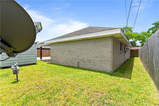 3818 Kingston Dr, Corpus Christi, TX 78415 - view of property exterior featuring brick siding, a fenced backyard, and roof with shingles