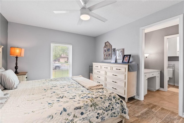 3818 Kingston Dr, Corpus Christi, TX 78415 - bedroom featuring light wood finished floors, a ceiling fan, and ensuite bathroom