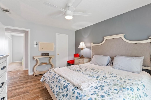 3818 Kingston Dr, Corpus Christi, TX 78415 - bedroom with light wood finished floors and a ceiling fan