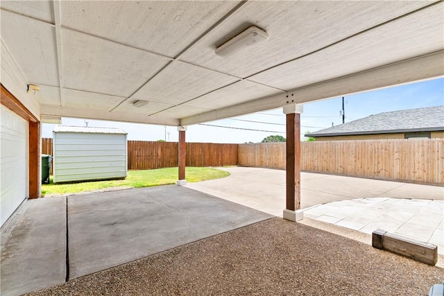 3818 Kingston Dr, Corpus Christi, TX 78415 - fenced backyard featuring a storage shed and a patio