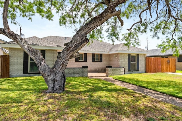 3818 Kingston Dr, Corpus Christi, TX 78415 - ranch-style house featuring brick siding and a shingled roof