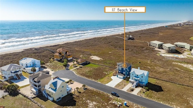 bird's eye view featuring a view of the beach and a water view