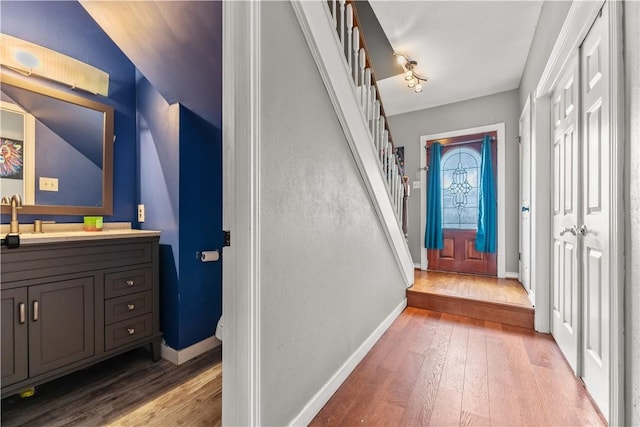 7401 Blue Lake Dr, Corpus Christi, TX 78413 - hall featuring light wood-style flooring, stairway, and vaulted ceiling