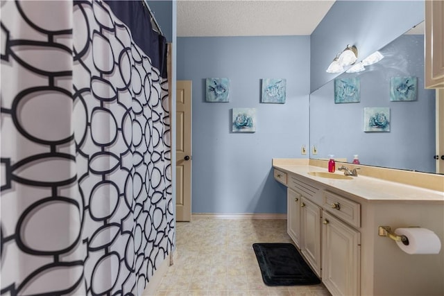 7401 Blue Lake Dr, Corpus Christi, TX 78413 - bathroom with vanity, a textured ceiling, and curtained shower