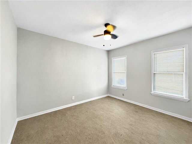 unfurnished room featuring ceiling fan