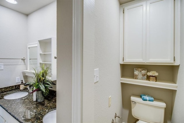 7421 Blue Lake Dr, Corpus Christi, TX 78413 - bathroom with toilet and double vanity