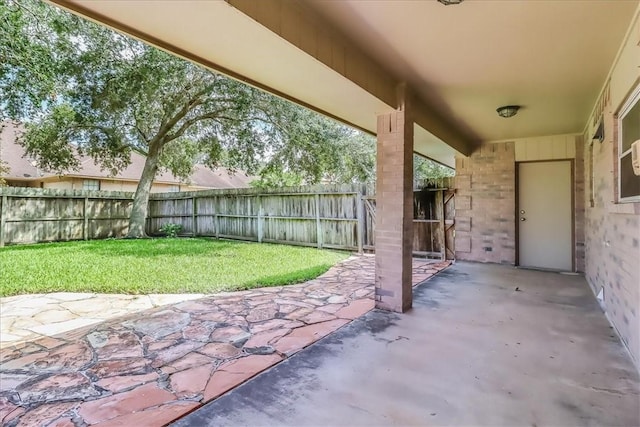 7421 Blue Lake Dr, Corpus Christi, TX 78413 - fenced backyard with a patio area
