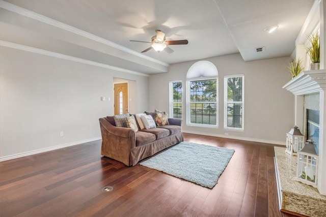 7421 Blue Lake Dr, Corpus Christi, TX 78413 - living area with ceiling fan, dark wood-style floors, and a premium fireplace