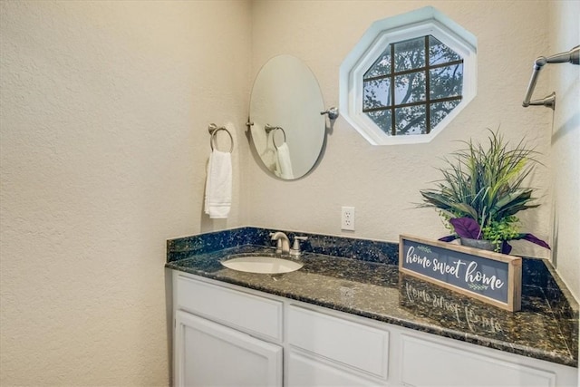 7421 Blue Lake Dr, Corpus Christi, TX 78413 - bathroom featuring a textured wall and vanity