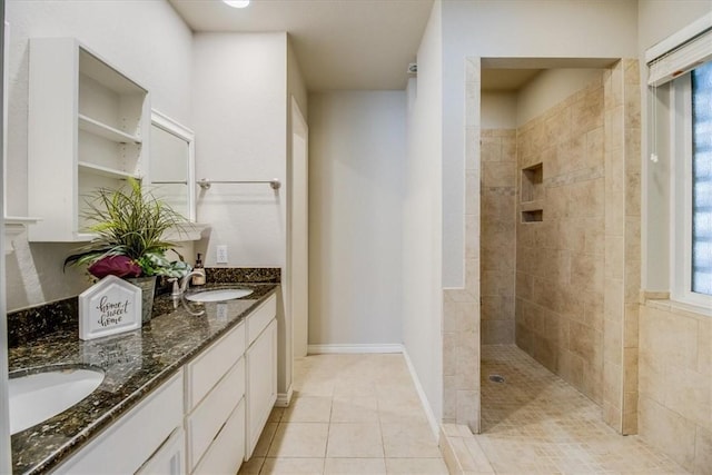 7421 Blue Lake Dr, Corpus Christi, TX 78413 - full bathroom with walk in shower, double vanity, and tile patterned floors