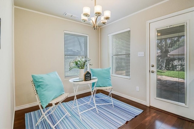 7421 Blue Lake Dr, Corpus Christi, TX 78413 - living area featuring a chandelier, ornamental molding, and wood finished floors