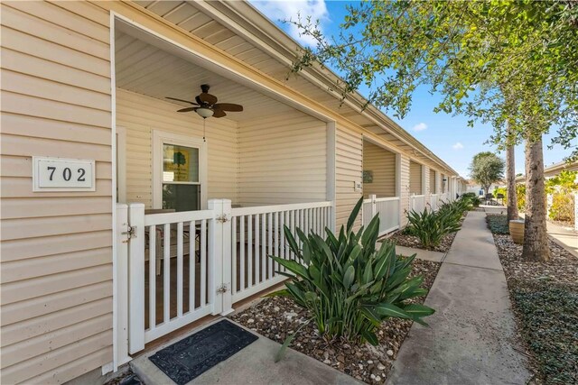 entrance to property featuring ceiling fan