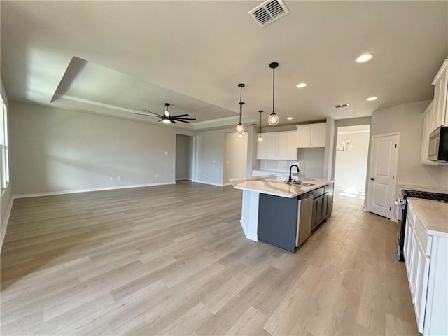 2605 Las Estrellas St, Corpus Christi, TX 78414 - kitchen with a sink, a ceiling fan, baseboards, appliances with stainless steel finishes, and recessed lighting
