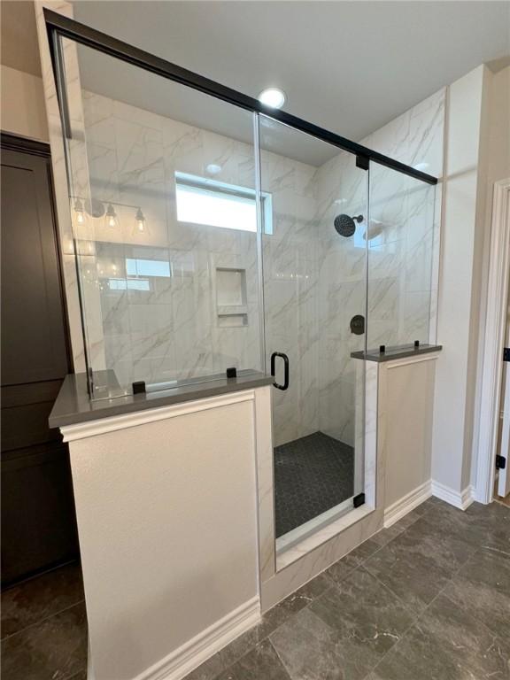 2605 Las Estrellas St, Corpus Christi, TX 78414 - full bathroom featuring a marble finish shower, baseboards, and vanity