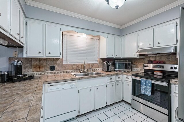 11805 Night Hawk, Corpus Christi, TX 78410 - kitchen with appliances with stainless steel finishes, under cabinet range hood, a sink, ornamental molding, and white cabinetry